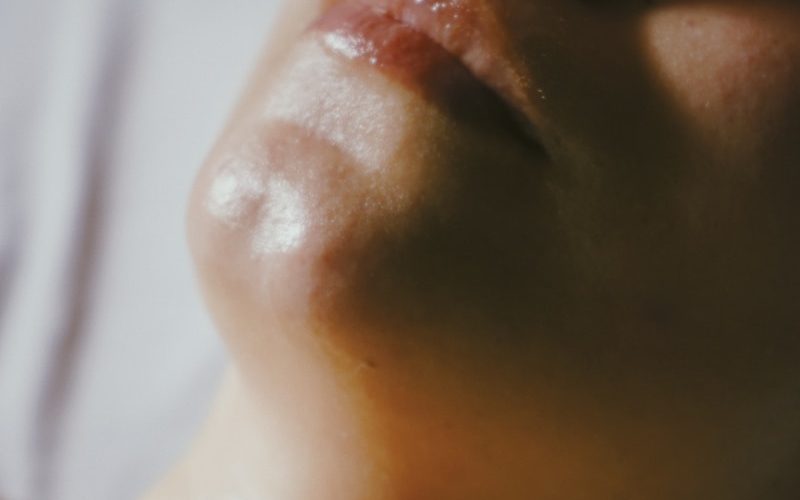 a woman getting a facial massage on her face